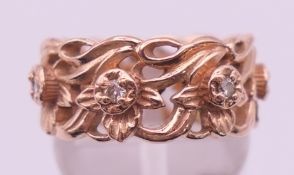 A 14 K rose gold and diamond set Stuart Devlin for Franklin Mint 'Eternal Daffodil' band ring.