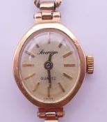 A Sovereign 9 ct gold ladies' wristwatch. 1.7 cm high. 8.1 grammes total weight.