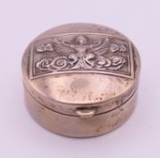 A Siam silver pill box, the lid depicting the Hindu-Buddhist goddess Manimekhala. 3.2 cm diameter.
