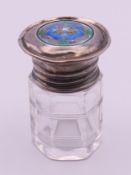 An Art Nouveau Tudor Rose motif silver and enamel lidded glass jar and stopper. 5.25 cm high, lid 3.