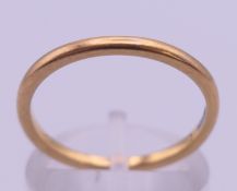A 22 ct gold wedding band. Ring size O. 2.6 grammes.