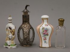 Four various scent bottles, including a Chinese sterling silver-mounted example.