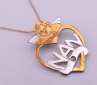 A boxed 'My Angel' 9 ct gold and diamond 'NAN' pendant on 9 ct gold chain.