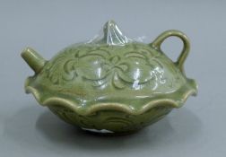 A Chinese celadon teapot. 16 cm long.
