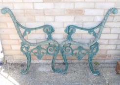 A pair of iron garden bench ends. 83 cm high.