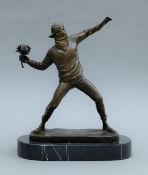 After BANKSY, bronze the Flower Thrower mounted on a marble plinth base 26.5 cm high.