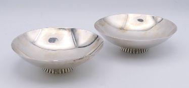 A boxed pair of Hamilton and Inches silver dishes. Each 15 cm diameter. 505.6 grammes.
