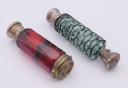 Two silver-mounted double-ended glass scent bottles.