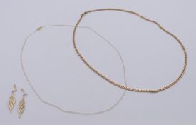 Two 9 ct gold chains and a pair of 9 ct gold earrings. Curb link chain 46 cm long. 7.8 grammes.