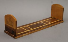 A 20th century Irish yew wood book rack. 42.5 cm long.