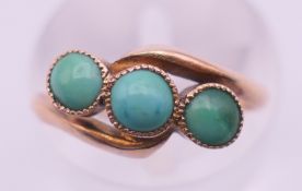 A 9 ct gold and turquoise ring. Ring size H. 1.3 grammes total weight.