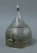 An 18th/19th century Indian Mughal white metal spice box, of helmet form,