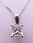 An 18 ct white gold and diamond pendant on an 18 ct white gold chain.