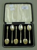 A cased set of silver teaspoons. The case 16 cm wide. 51.9 grammes.