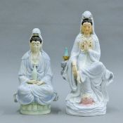 Two porcelain figures of Guanyin. The larger 31 cm high.