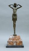 An Art Deco-style bronze of a dancing girl on marble plinth base. 52 cm high.