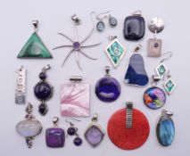 A quantity of mainly silver mounted stone-set and other pendants and three pairs of earrings.