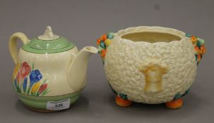 A Clarice Cliff Crocus pattern teapot and a Clarice Cliff Celtic Harvest pattern pot.