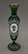 A 19th century Bohemian green glass vase decorated with trailing vines and a Classical female