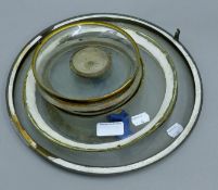 A quantity of clock and barometer glasses. The largest 29 cm diameter.