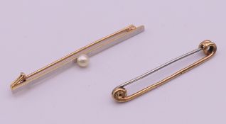 Two unmarked gold tie pins. Pearl tiepin 5.7 cm long. 5.3 grammes total weight.