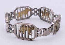 A travelling circus zoo animal silver bracelet designed by Robert Kiefer,