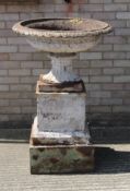 A large cast iron garden urn on stand. 75 cm diameter.