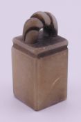A soapstone seal. 4.5 cm high.