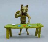 A cold-painted bronze model of a cardplaying fox. 10.5 cm wide.