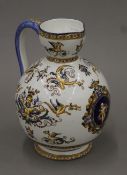 A faience porcelain ewer. 22 cm high.