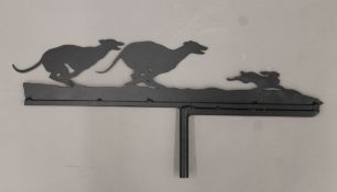 A wrought iron coursing greyhound weather vane. 60 cm long.