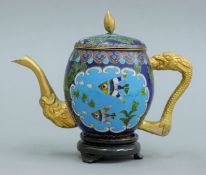 A cloisonne teapot on stand. 12.5 cm high overall.