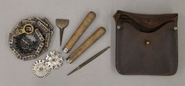 A WW II Special Forces saw kit in leather pouch dated 1943. 17 cm wide.