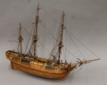 A large wooden model of a three-masted sailing ship. 80 cm long.