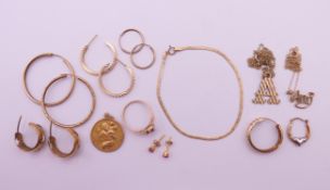 A collection of 9 ct gold jewellery to include a St Christopher pendant, a ring, a bracelet,