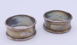 A pair of silver napkin rings. 2 cm high, 4.5 cm diameter. 26.8 grammes.