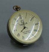 A ball clock. 8.5 cm high.