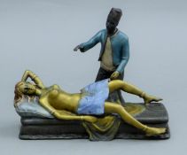 A Vienna bronze of an Arab lifting a lady's skirt. 19 cm long.