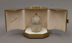 A cased Theo Faberge glass egg-form box enclosing a silver model of coral.