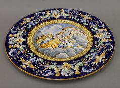 A faience charger marked B M. 55 cm diameter.