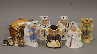 A quantity of Toby jugs and a teapot. The largest 16 cm high.