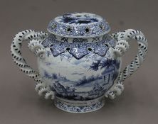 A Delft porcelain lidded tulip vase. 40 cm wide.
