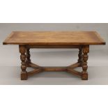 A large oak draw leaf table. 183 cm long closed x 275 cm long extended x 91 cm wide.