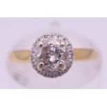 An 18 ct gold and diamond (0.