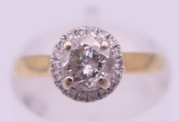 An 18 ct gold and diamond (0.