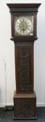 An 18th century carved oak longcase clock, the dial inscribed W Russell Wootton. 193.5 cm high.