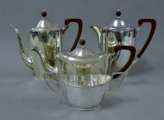 A four-piece silver tea and coffee set. The teapot 30 cm long. 73.3 troy ounces total weight.