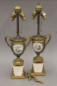 A pair of 19th century Continental ormolu-mounted painted porcelain vases, mounted as table lamps.