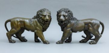 A pair of bronze lions. Each 30 cm long.