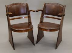 A pair of Art Deco oak open armchairs. Each 48 cm wide.